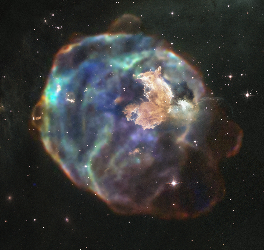 超新星殘骸N63A的多波段影像，右上區域金黃色的團塊是哈伯拍攝的可見光，外圍球殼狀構造則是X射線。（圖／Enhanced Image by Judy Schmidt (CC BY-NC-SA) based on images provided courtesy of NASA/CXC/SAO & NASA/STScI.）